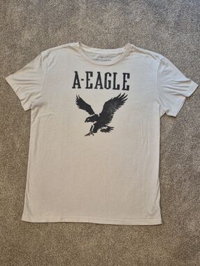 American Eagle Outfitters Men's Cream Tee with Black Eagle Graphic